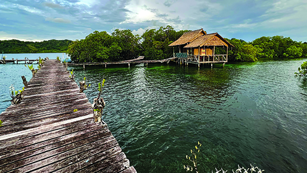 house on the water and a dock