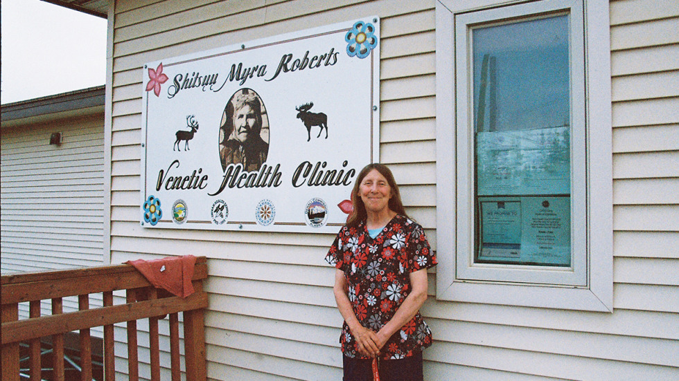 Woman standing outside medical clinic