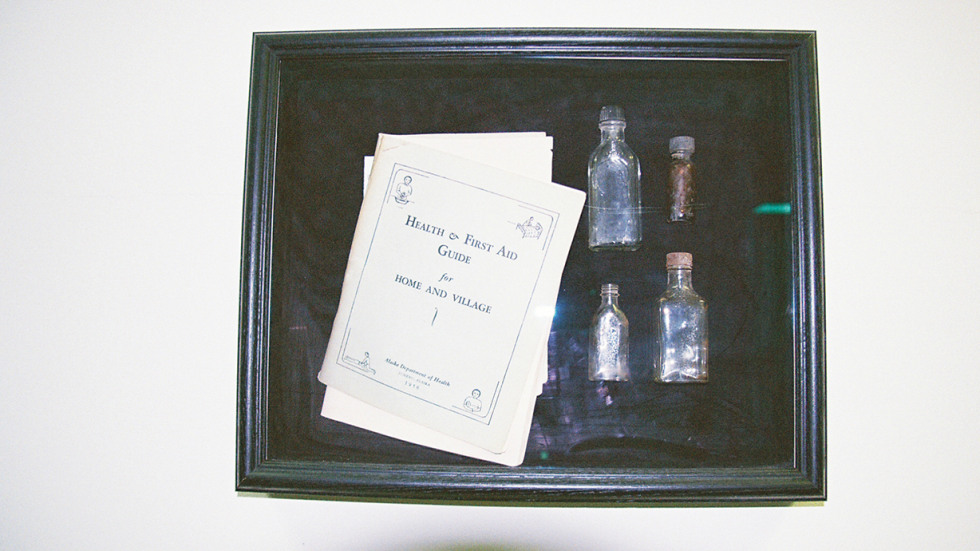 Medicine vials and a 1956 first aid guide