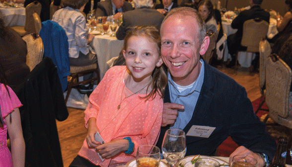 Edmond Paquette MD'94 enjoys the Reunion dinner with his daughter, Cecilia. (credit: David DelPoio)