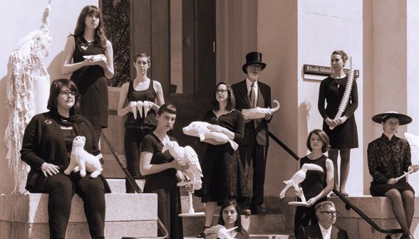Members of the Jenks Society for Lost Museums on the steps of Rhode Island Hall with “ghost objects” that symbolize the Jenks collection’s lost artifacts. (Credit: Jodie Goodnough)
