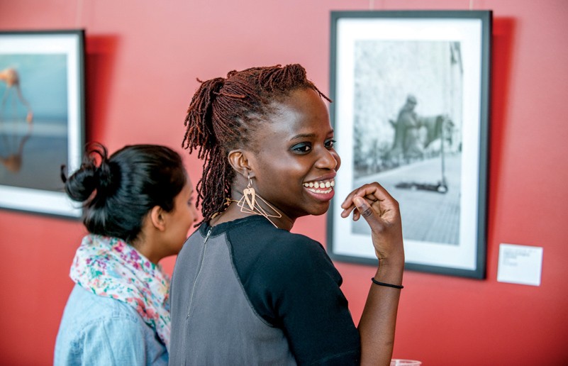 Students find familiar names at the opening reception. (Credit: David Del Poio)