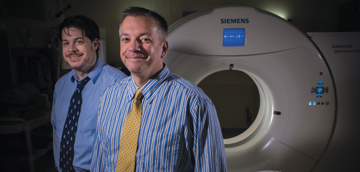 INNER SPACE:Derek Merck, left, and Scott Collins use CT scan data in much of their research. (Photo Credit: Jason Rossi).
