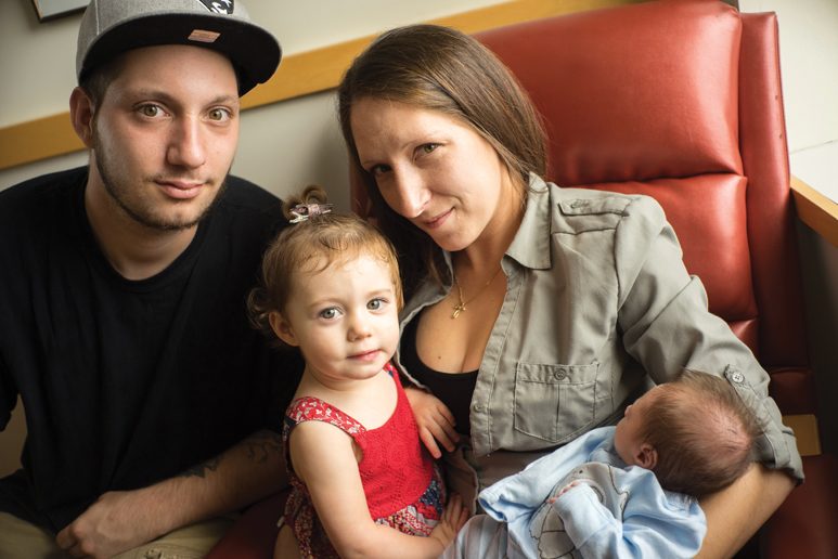 TEAM EFFORT: Perry Fedorak, Caitlyn O ’Brien, and their children, Hailie and Bentley, at Women & Infants Hospital. Maternal-infant bonding can help speed a baby’s recovery from neonatal abstinence syndrome. Photo by Karen Philippi