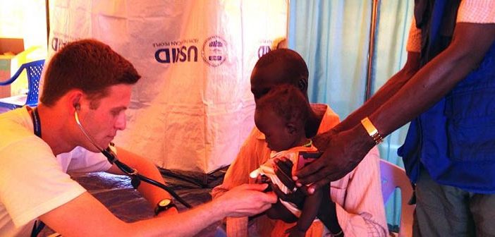 Adam Levine, MD, treats a child at an International Medical Corps clinic in Juba, South Sudan. Photo courtesy Levine