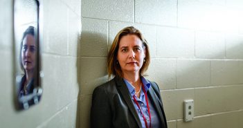 WONDER WOMAN: Jennifer Clarke in a temporary holding cell inside the dispensary at the Rhode Island Department of Corrections’ John J. Moran Medium Security Facility in Cranston, RI. Clarke is RIDOC’s medical programs director. Photo by Jared Leeds