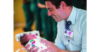 Adam Czynski, director of the newborn nursery at Women & Infants, cares for babies born dependent on opioids. Photo by Karen Philippi