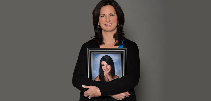 Patti Wukovits holds a photo of her daughter, Kim Coffey, who died in 2012 after contracting meningitis. Photo courtesy Kimberly Coffey Foundation